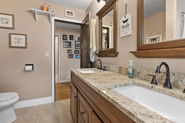12554 Knoll Rd, Elm Grove, WI 53122 - full bath featuring toilet and double vanity