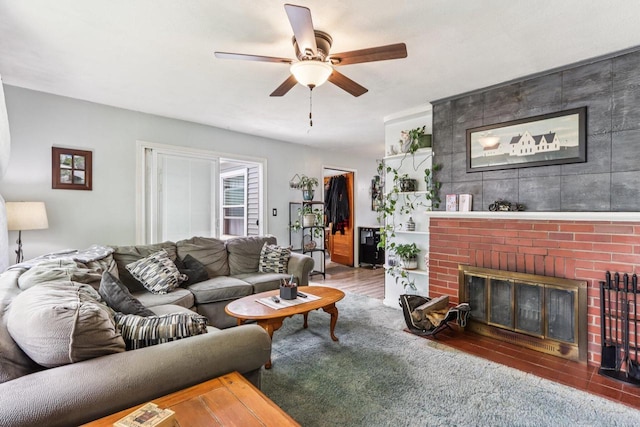 3036 S 65th Ct, Milwaukee, WI 53219 - living room featuring a ceiling fan, a brick fireplace, and wood finished floors