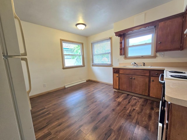 9829 W Lincoln Ave, West Allis, WI 53227 - kitchen with a baseboard heating unit, freestanding refrigerator, a sink, dark wood finished floors, and electric stove