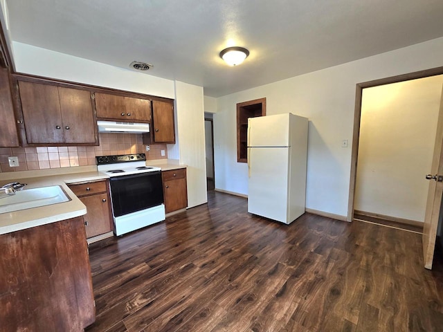 9829 W Lincoln Ave, West Allis, WI 53227 - kitchen with freestanding refrigerator, electric range, exhaust hood, a sink, and light countertops