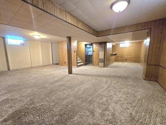 9829 W Lincoln Ave, West Allis, WI 53227 - below grade area featuring stairs, carpet flooring, and wood walls