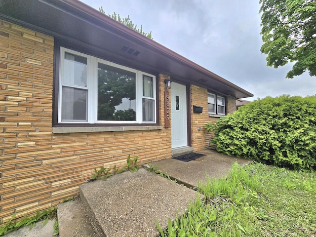 9829 W Lincoln Ave, West Allis, WI 53227 - doorway to property with brick siding