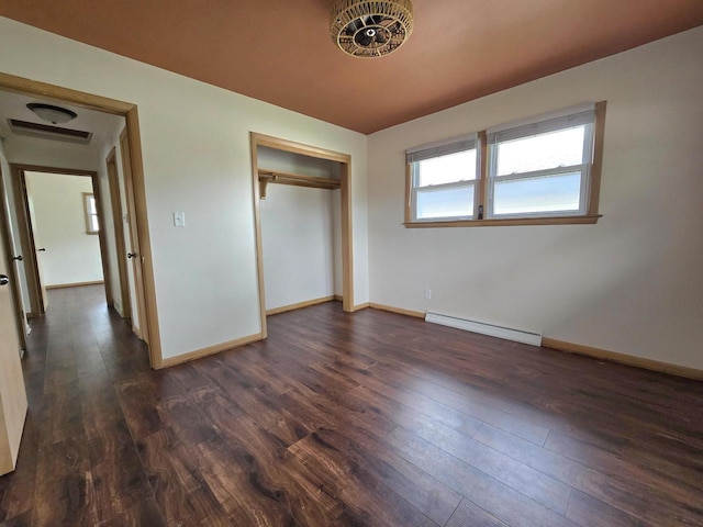 9829 W Lincoln Ave, West Allis, WI 53227 - unfurnished bedroom with a baseboard radiator, dark wood-style flooring, baseboards, and a closet