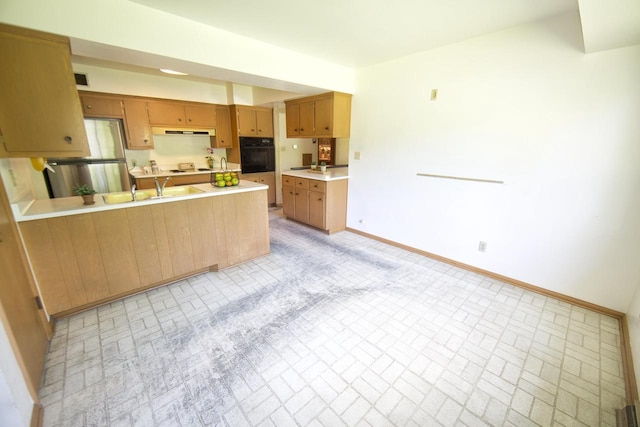 8680 N Point Dr, Fox Point, WI 53217 - kitchen featuring black oven, a sink, brick patterned flooring, and baseboards