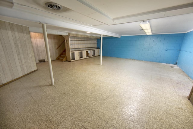 8680 N Point Dr, Fox Point, WI 53217 - finished basement featuring stairs, concrete block wall, tile patterned floors, and wood walls