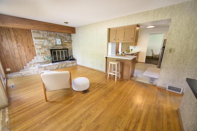 8680 N Point Dr, Fox Point, WI 53217 - living area with light wood-style floors, a fireplace, baseboards, and wallpapered walls