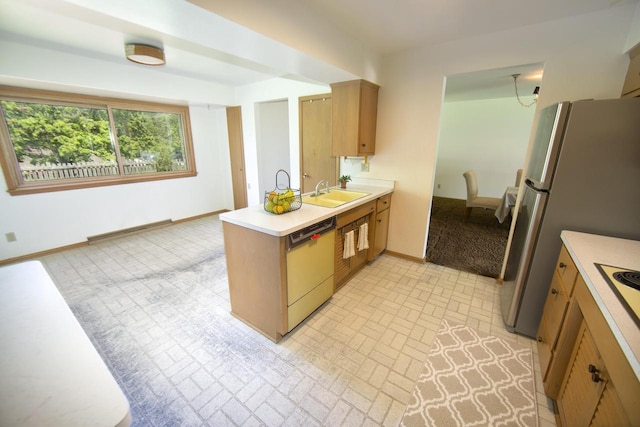 8680 N Point Dr, Fox Point, WI 53217 - kitchen featuring dishwashing machine, a peninsula, light countertops, a sink, and baseboards