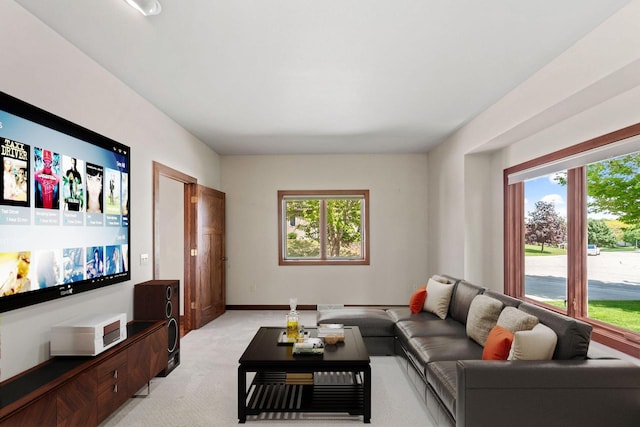 100 Accipiter Ct, Burlington, WI 53105 - living room featuring light carpet, healthy amount of natural light, and baseboards