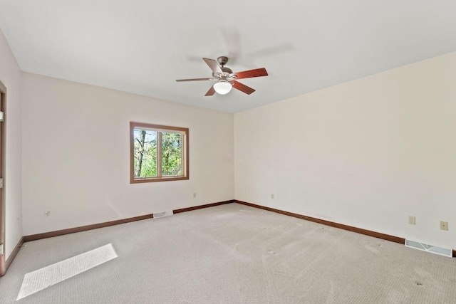 100 Accipiter Ct, Burlington, WI 53105 - unfurnished room with light colored carpet, baseboards, and ceiling fan