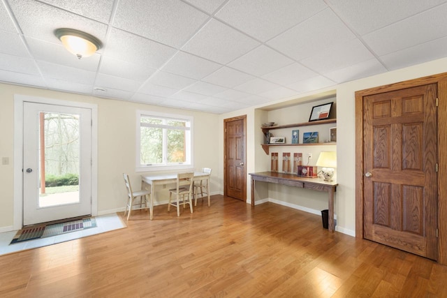 100 Accipiter Ct, Burlington, WI 53105 - dining space with a drop ceiling, light wood-type flooring, and baseboards