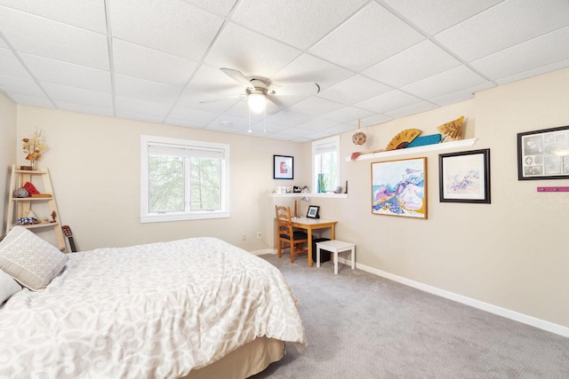 100 Accipiter Ct, Burlington, WI 53105 - carpeted bedroom featuring a paneled ceiling, baseboards, and a ceiling fan