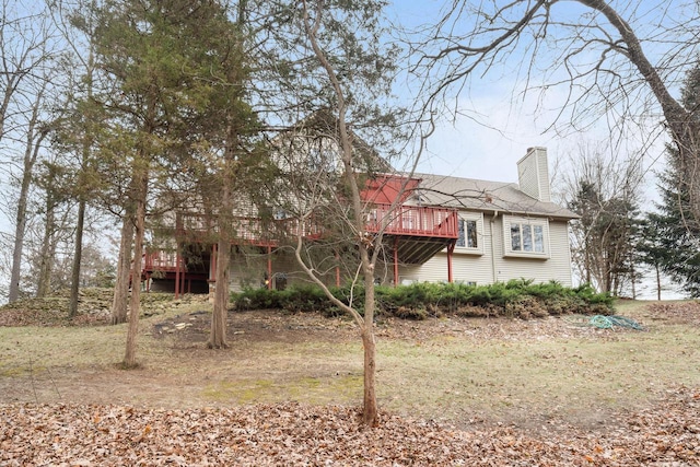 100 Accipiter Ct, Burlington, WI 53105 - view of front of property with a chimney, a deck, and roof with shingles