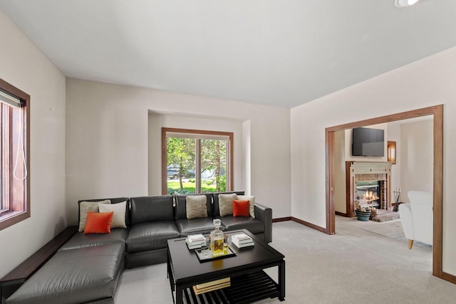 100 Accipiter Ct, Burlington, WI 53105 - living room with light carpet, a brick fireplace, and baseboards