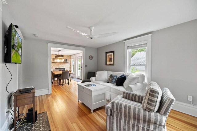 170 N Lakeshore Dr, Fontana, WI 53125 - living area featuring plenty of natural light, light wood-style floors, ceiling fan, and baseboards