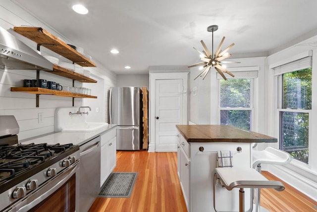 170 N Lakeshore Dr, Fontana, WI 53125 - kitchen featuring appliances with stainless steel finishes, wood counters, recessed lighting, a sink, and light wood-style floors