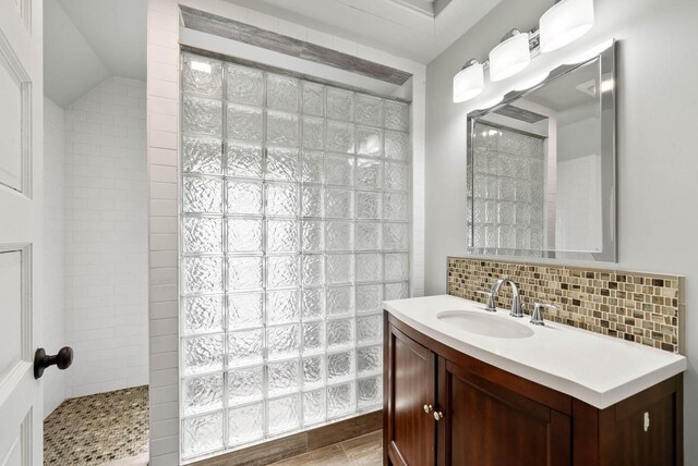 170 N Lakeshore Dr, Fontana, WI 53125 - bathroom with backsplash, a walk in shower, and vanity