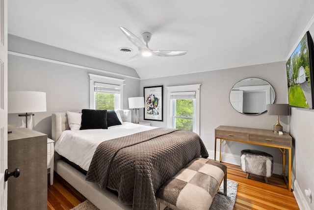 170 N Lakeshore Dr, Fontana, WI 53125 - bedroom featuring wood finished floors, vaulted ceiling, a ceiling fan, and baseboards