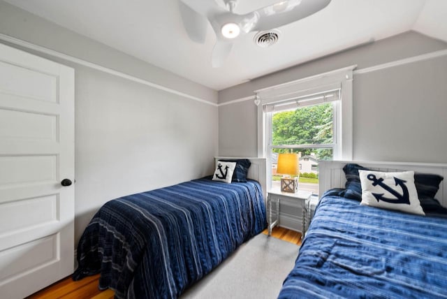 170 N Lakeshore Dr, Fontana, WI 53125 - bedroom with wood finished floors, a ceiling fan, and vaulted ceiling