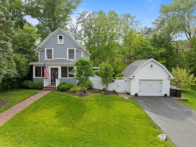 170 N Lakeshore Dr, Fontana, WI 53125 - dutch colonial with a detached garage, a gambrel roof, an outdoor structure, asphalt driveway, and a shingled roof