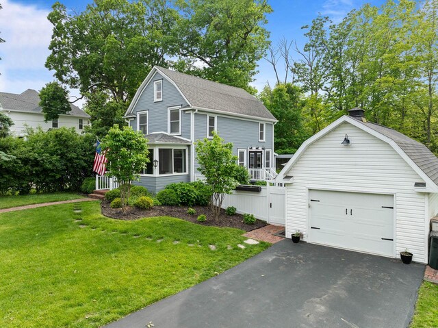 170 N Lakeshore Dr, Fontana, WI 53125 - view of front facade with a front yard, asphalt driveway, roof with shingles, and a gambrel roof