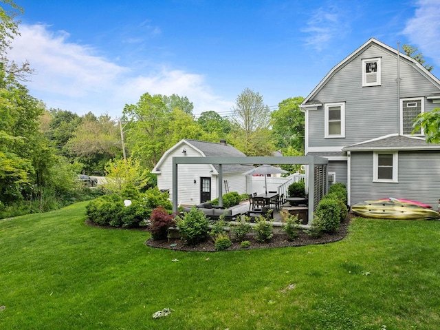 170 N Lakeshore Dr, Fontana, WI 53125 - back of house featuring a lawn, an outbuilding, a gambrel roof, and a patio