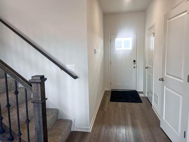 5010 Linden Rd, Mount Pleasant, WI 53403 - entryway with dark wood-type flooring, stairway, and baseboards