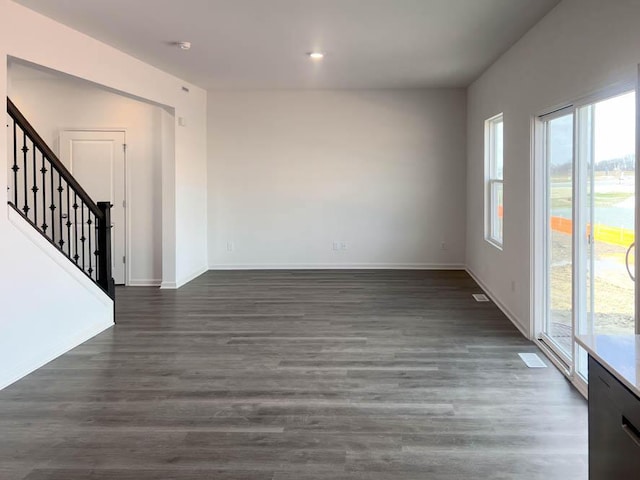 5010 Linden Rd, Mount Pleasant, WI 53403 - spare room featuring plenty of natural light, stairs, dark wood-style floors, baseboards, and recessed lighting