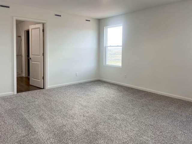 5010 Linden Rd, Mount Pleasant, WI 53403 - empty room with dark carpet and baseboards