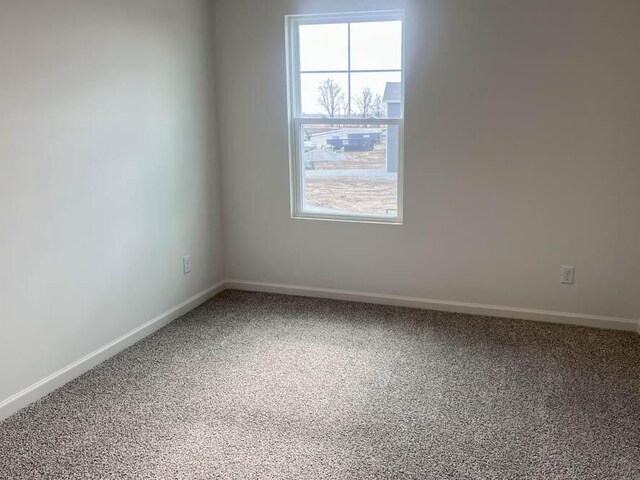 5010 Linden Rd, Mount Pleasant, WI 53403 - empty room featuring healthy amount of natural light, carpet flooring, and baseboards