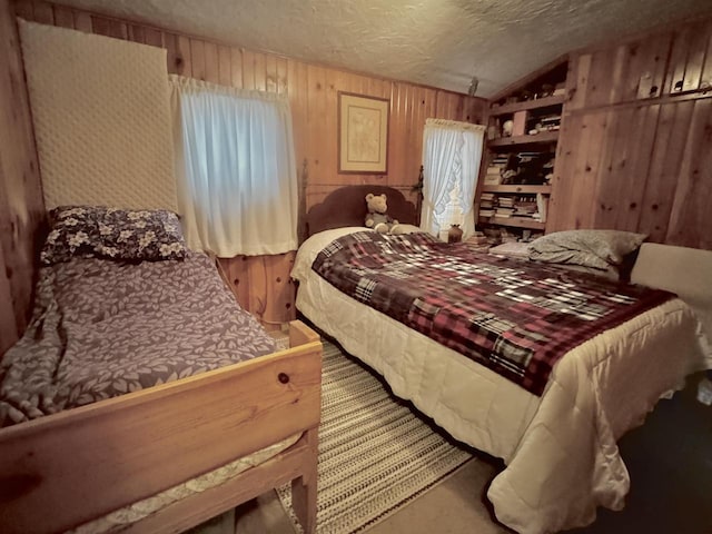 1657 N Elm Rd, Junction City, WI 54443 - carpeted bedroom featuring wood walls, vaulted ceiling, and a textured ceiling
