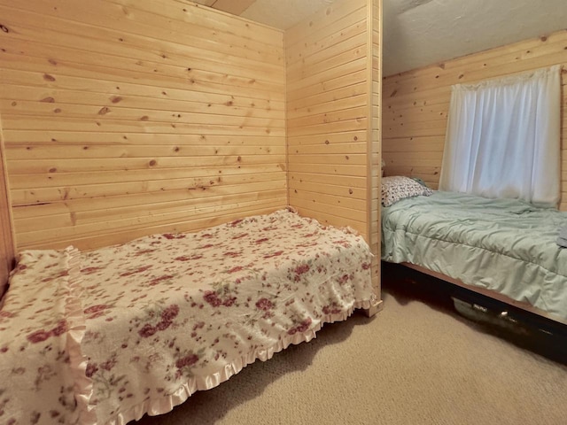 1657 N Elm Rd, Junction City, WI 54443 - bedroom featuring wooden walls and carpet flooring
