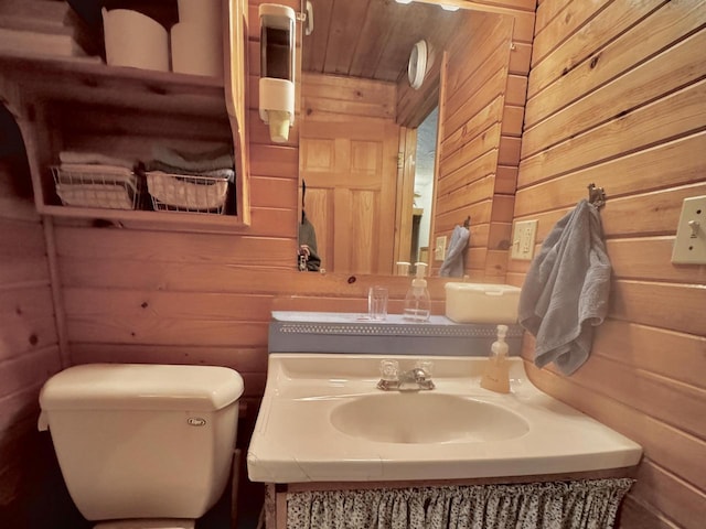 1657 N Elm Rd, Junction City, WI 54443 - half bath featuring wood walls, toilet, and vanity