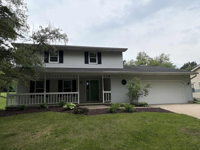 1230 N Westfield Rd, Madison, WI 53717 - view of front facade featuring an attached garage, covered porch, driveway, and a front yard