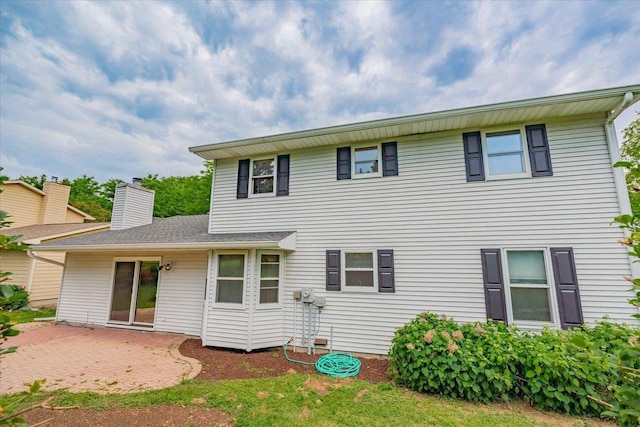 1230 N Westfield Rd, Madison, WI 53717 - rear view of house featuring a patio area and a chimney
