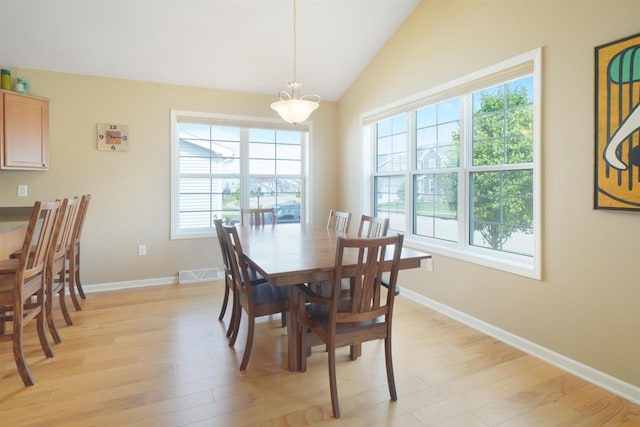 951 Lavender Way, Deforest, WI 53532 - dining area featuring light wood finished floors, vaulted ceiling, and baseboards