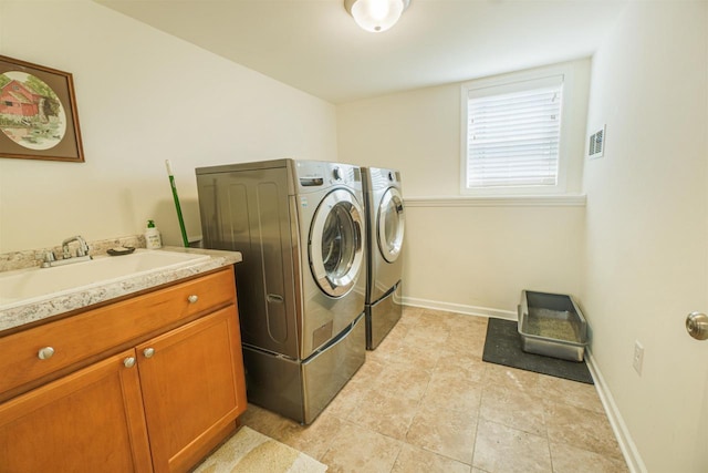 951 Lavender Way, Deforest, WI 53532 - washroom featuring washer and clothes dryer, cabinet space, baseboards, and light tile patterned floors