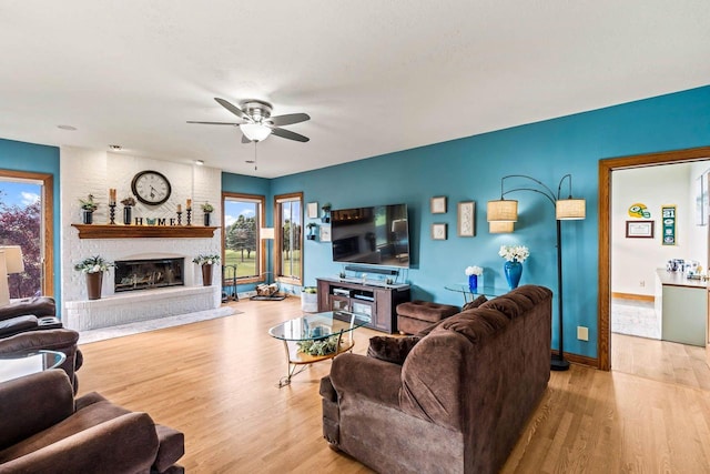 W4745 Briar Dr, Elkhorn, WI 53121 - living area with a ceiling fan, healthy amount of natural light, wood finished floors, and a brick fireplace