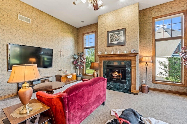 W4745 Briar Dr, Elkhorn, WI 53121 - living room featuring a ceiling fan, a high end fireplace, carpet floors, and baseboards