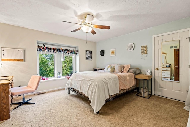 W4745 Briar Dr, Elkhorn, WI 53121 - bedroom with carpet flooring, a ceiling fan, baseboards, and a textured ceiling