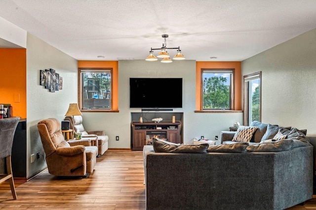W4745 Briar Dr, Elkhorn, WI 53121 - living room featuring wood finished floors, plenty of natural light, and baseboards