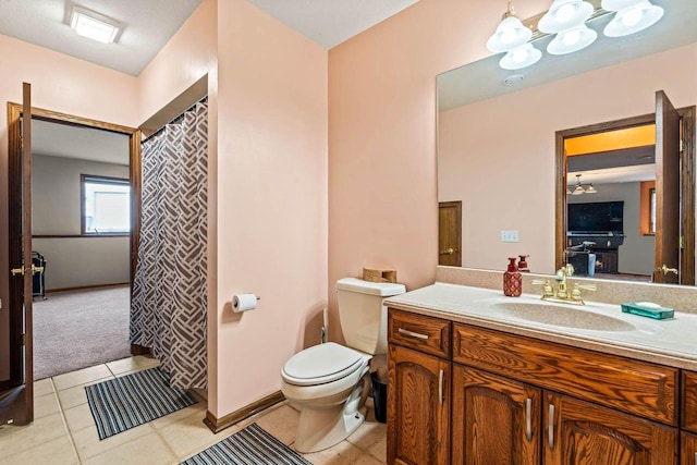 W4745 Briar Dr, Elkhorn, WI 53121 - bathroom featuring vanity, toilet, tile patterned flooring, and a chandelier