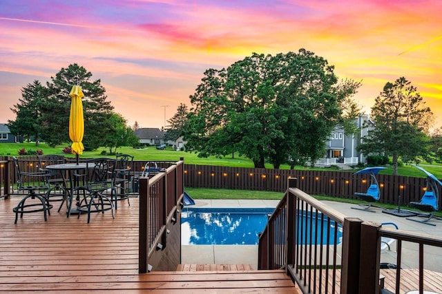 W4745 Briar Dr, Elkhorn, WI 53121 - pool at dusk featuring outdoor dining area