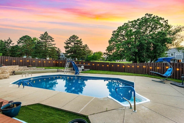 W4745 Briar Dr, Elkhorn, WI 53121 - view of pool featuring a water slide, a patio area, and a fenced backyard