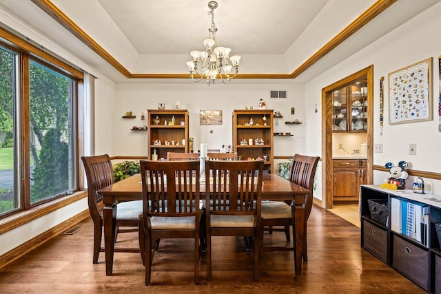 W4745 Briar Dr, Elkhorn, WI 53121 - dining area featuring a chandelier, a tray ceiling, and dark wood-style flooring