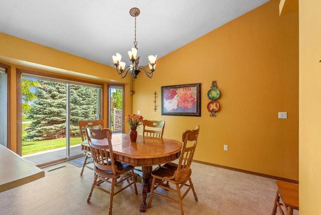 136 Yacoub Ln, Fond Du Lac, WI 54935 - dining area with lofted ceiling, a chandelier, and baseboards