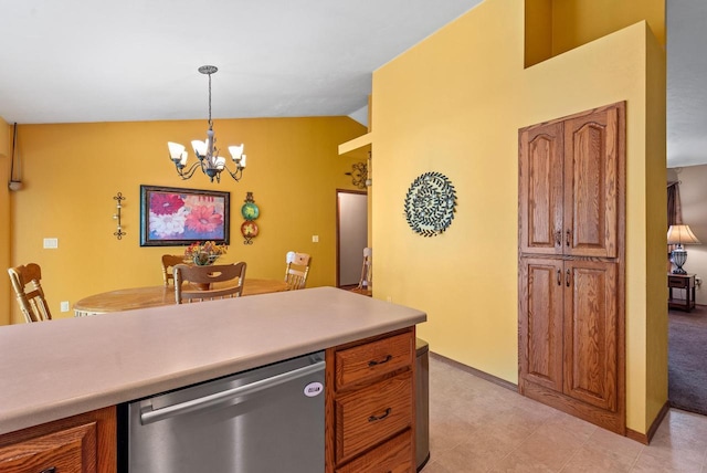 136 Yacoub Ln, Fond Du Lac, WI 54935 - kitchen with stainless steel dishwasher, a chandelier, pendant lighting, light countertops, and brown cabinetry