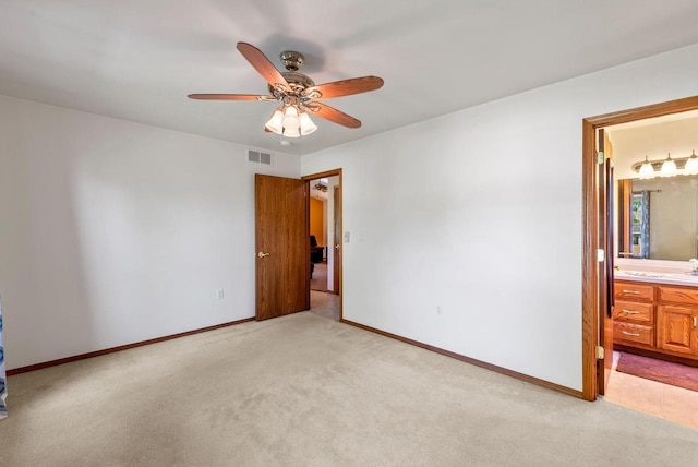 136 Yacoub Ln, Fond Du Lac, WI 54935 - unfurnished room featuring light colored carpet, ceiling fan, and baseboards