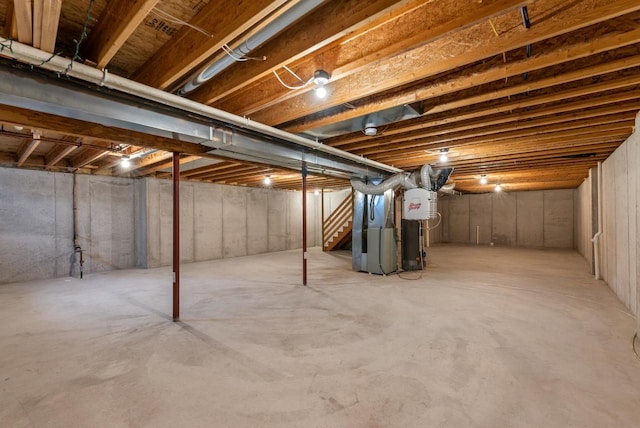 136 Yacoub Ln, Fond Du Lac, WI 54935 - unfinished basement with heating unit, stairs, and water heater