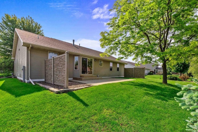 136 Yacoub Ln, Fond Du Lac, WI 54935 - rear view of house with a patio, a yard, and entry steps