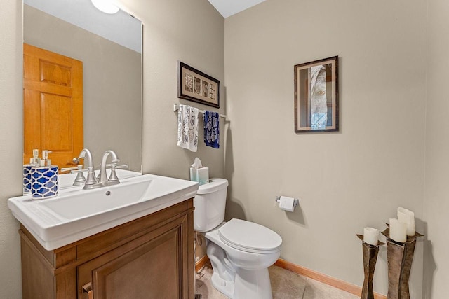 691 N River St Unit 1, Merrimac, WI 53561 - half bathroom with toilet, vanity, baseboards, and tile patterned floors